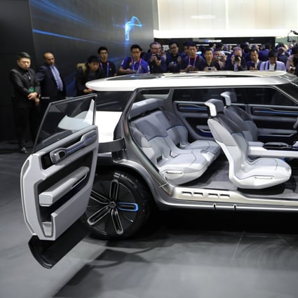 A Geely car is unveiled at the 2018 Beijing International Automotive Exhibition. Saxo Bank has already made headway in testing a prototype app in Geely cars in China. Photo: Simon Song
