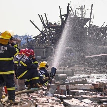Firefighters at work in the rubble of the chemical plant. Photo: Reuters