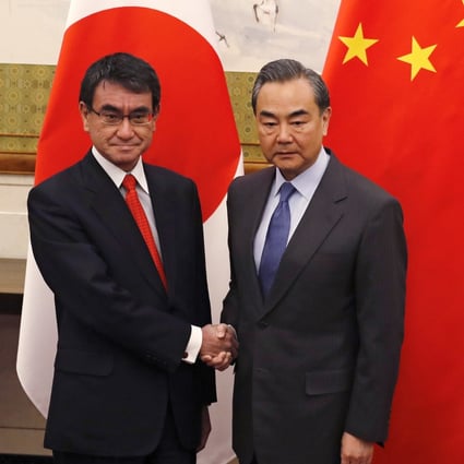 Japanese Foreign Minister Taro Kono, left, who will lead the delegation to bilateral economic talks in Beijing, and Chinese Foreign Minister Wang Yi. Photo: AP