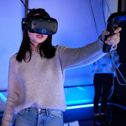 China had an estimated 3,000 virtual reality arcades in 2016, and the market was forecast to grow 13-fold between then and 2021. Photo: AFP