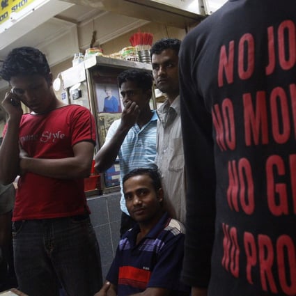 Labourers from Bangladesh at a coffee shop in Singapore’s Little India district. Photo: Reuters