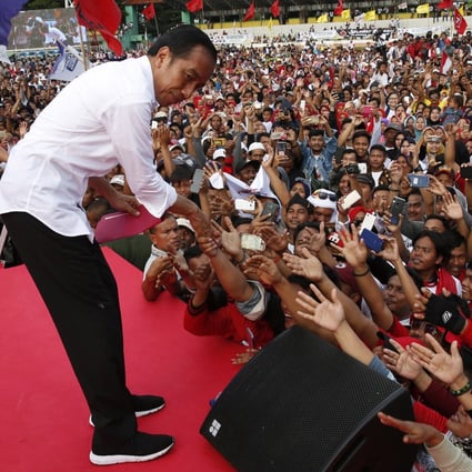 President Joko Widodo meeting supporters at a campaign rally. Photo: EPA-EFE