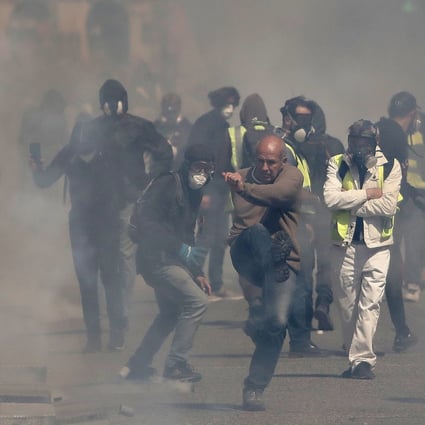 Protesters from the “Gilets Jaunes” (Yellow Vests) movement clash with French riot police in Toulouse, France, on Saturday. Photo: EPA-EFE
