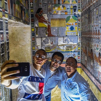 Mohamed Mujahid, head of the Egyptian mission which discovered the tomb of the ancient Egyptian nobleman “Khewi”, takes a selfie. The tomb at the Saqqara necropolis dates back to the 5th dynasty (2494-2345 BC). Photo: AFP