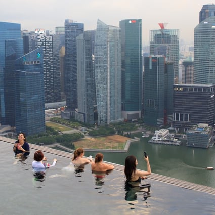 The rooftop pool of Marina Bay Sands in an area built on reclaimed land in Singapore. The land mass of Singapore has increased by about 22 per cent since independence in 1965. Photo: AFP