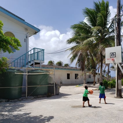 Children play basketball in the court next to the Marshall Islands' only mosque. Photo: Sajid Iqbal