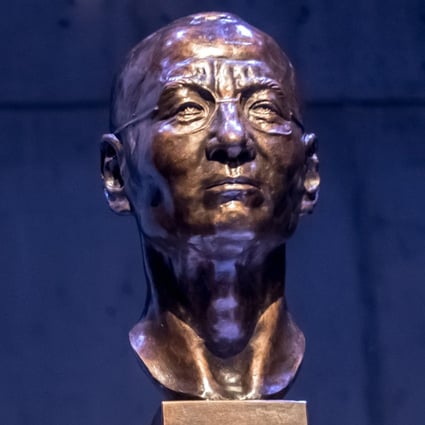 Zhou Fengsuo, a former Tiananmen student leader in 1989, unveiling the bust of Liu Xiaobo, Chinese Nobel Peace Prize winner, at the Dox Centre for Contemporary Art in Prague. Photo: EPA-EFE
