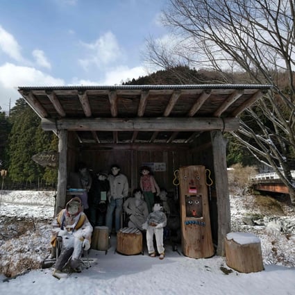 Life-size dolls looking on from a bus stop in the tiny village of Nagoro in western Japan. Photo: AFP