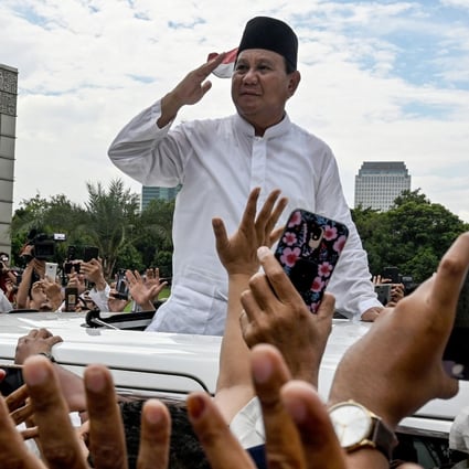 Prabowo Subianto gestures to supporters as he leaves a mosque after Friday prayers in Jakarta. Photo: AFP