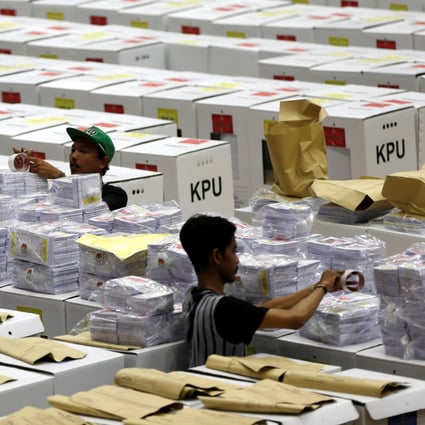 Workers prepare ballots for Indonesia’s election at a warehouse in Jakarta on April 15. Photo: Reuters
