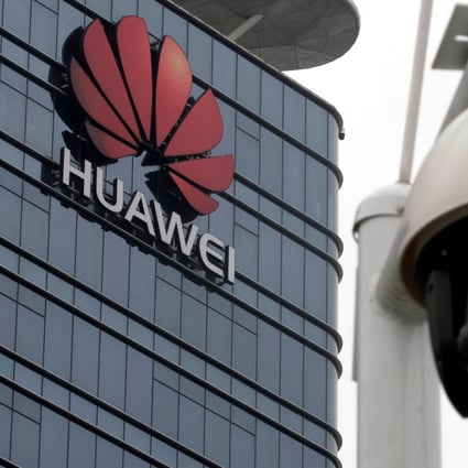 A surveillance camera is seen in front of the Huawei logo outside its factory campus in Dongguan, China, in March. Photo: Reuters