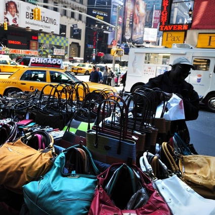Fake designer handbags for sale in New York, where counterfeit luxury goods from brands like Gucci, Dior, Louis Vuitton and Burberry can all be found for a fraction of the price of the originals. Photo: Alamy