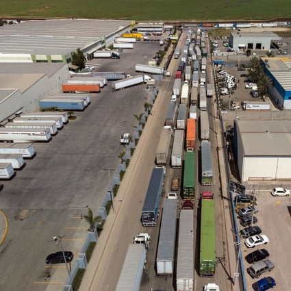 Aerial view of cargo trucks lining up to cross to the United States near the US-Mexico border (top) at Otay Mesa crossing port in Tijuana, Baja California state, Mexico, on April 2, 2019. Photo: Agence France-Presse