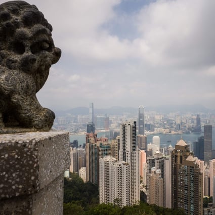 A general view taken from Victoria Peak shows residential and commercial buildings in Hong Kong on September 27, 2018. – Two of Hong Kong's biggest banks raised their lending rates on September 27 for the first time in 12 years, ending an age of cheap cash that could hit the city's famously red-hot property market. (Photo by Anthony WALLACE / AFP)