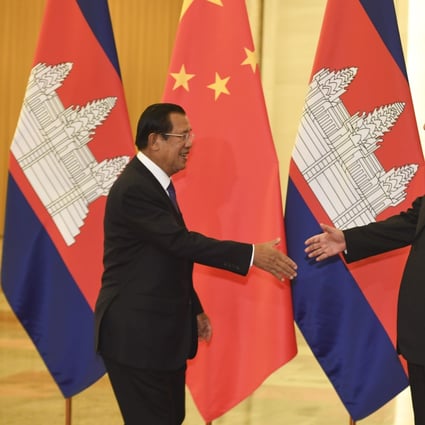 Cambodia’s Prime Minister Hun Sen shakes hands with Chinese President Xi Jinping before their meeting at the Great Hall of the People in Beijing last month. Photo: AP