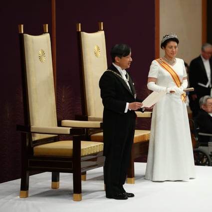 Japan’s Emperor Naruhito, flanked by Empress Masako, delivers a speech during a ceremony after his accession to the throne. Photo: Reuters