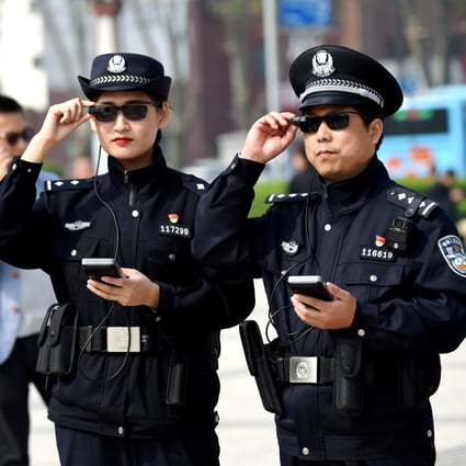 Police officers display their artificial intelligence-powered smart glasses in Luoyang, a city in central China’s Henan province, on April 3, 2018. Photo: Reuters