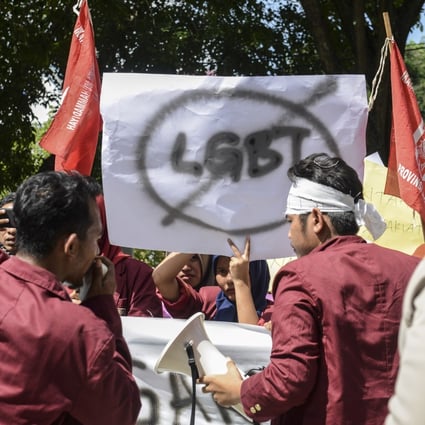 Muslim protesters march with banners against the LGBT community in Indonesia. Photo: AFP
