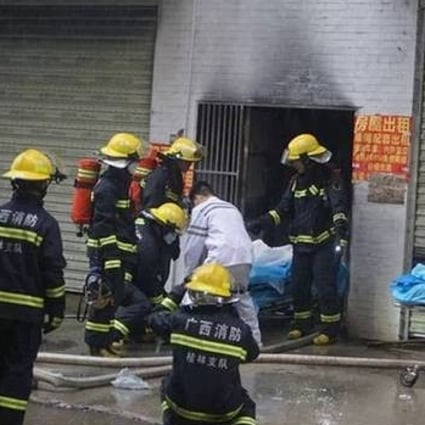 Rescue teams in Guilin attend a fire at a student dormitory where five people were killed and more than 30 injured. Photo: Weibo
