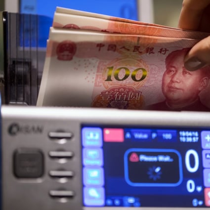 An employee uses a machine to count Chinese 100 yuan banknotes at the Hang Seng Bank’s headquarters in Hong Kong on Tuesday, April 16, 2019. Photo: Bloomberg