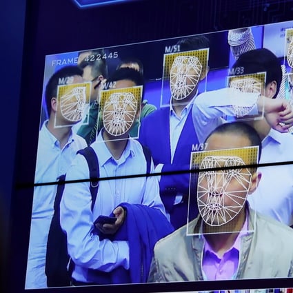Visitors experience facial recognition technology at the Megvii booth during the China Public Security Expo in Shenzhen in 2017. Photo: Reuters