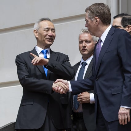 Chinese Vice-Premier Liu He and US Trade Representative Robert Lighthizer bid farewell after trade talks between the two countries in Washington on Friday. Photo: EPA-EFE