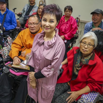 Rehabaid Society CEO Cecilia Lam with patients in wheelchairs. Photo: Winson Wong
