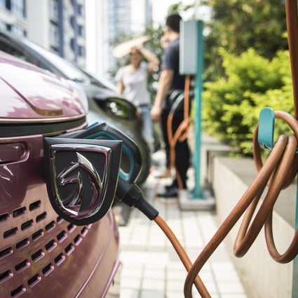 A Baojun E100 electric vehicle (EV) stands plugged in to a charging station outside a charging Centre in Liuzhou, Guangxi province on Wednesday, May 23, 2018. Photo: Bloomberg