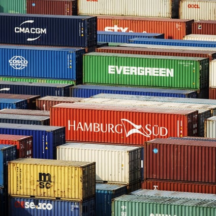 Shipping containers sit stacked at the Yangshan Deepwater Port, operated by Shanghai International Port Group in Shanghai, China, on May 10, 2019. Photo: Bloomberg