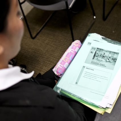 A Filipino trainee housekeeper receives tuition from Japanese staffing company Pasona Group. Photo: Bloomberg