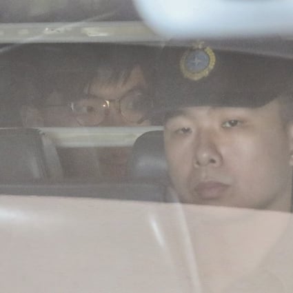Joshua Wong is escorted from Hong Kong’s High Court after winning an appeal to reduce his prison sentence, then being sent back to jail to serve it. Photo: Felix Wong