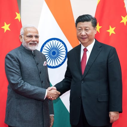 Indian Prime Minister Narendra Modi meets Chinese President Xi Jinping at the Shanghai Cooperation Organisation summit in Qingdao, in east China's Shandong province, on June 9, 2018. Photo: Xinhua