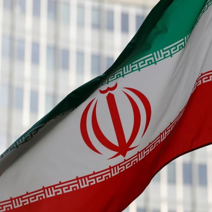 The Iranian flag flutters in front the International Atomic Energy Agency (IAEA) headquarters in Vienna. Photo: Reuters