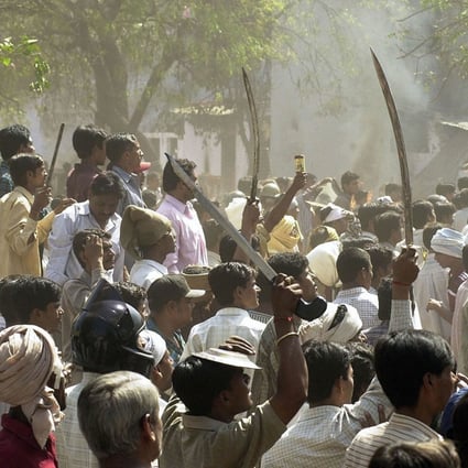 A Hindu mob faces off with a Muslim mob during during Gujarat’s 2002 riots. Photo: AFP