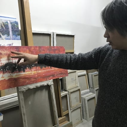 Artist Chen Guang reflects on the painting Blood Red Anxiety at his studio in Beijing. Photo: Mimi Lau