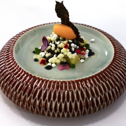 The dessert of mango sorbet, coconut pearls and black sesame purée, is one of the fine-dining offerings served at the restaurant Aperitif, at Viceroy Bali, in Ubud, Bali.