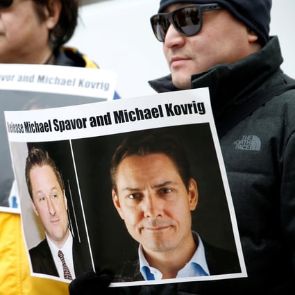 Protesters hold signs calling for China to release Canadian detainees Michael Spavor and Michael Kovrig during an extradition hearing for Huawei executive Meng Wanzhou in Vancouver in March. Photo: Reuters