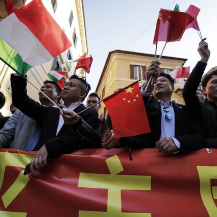Chinese residents of Italy wave Chinese and Italian flags as they wait for the arrival of Xi Jinping in Rome on March 22. China has long viewed language instruction as a necessary component for achieving diplomacy and trade goals, and the Belt and Road Initiative has resulted in a wave of new languages as majors. Photo: EPA-EFE