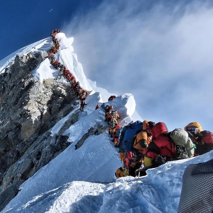 A traffic jam of climbers block the route to and from the summit of Everest, possibly killing Anjali Kulkarni after she spent too long at high altitude. Photo: Project possible
