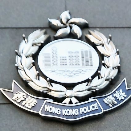 Hong Kong Police officers on Tuesday raided the offices of the company accused of running a gold scam. Photo: Nora Tam