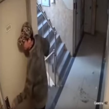 A screenshot from the viral video clip showing a man trying to force his way into a woman’s flat in Seoul’s Sillim-dong neighbourhood. Photo: YouTube