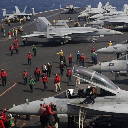 F/A-18 Super Hornet fighter jets on the deck of the USS Ronald Reagan in the South China Sea in 2018. Photo: AP