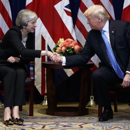 President Donald Trump shakes hands as he meets with British Prime Minister Theresa May. Photo: AP Photo