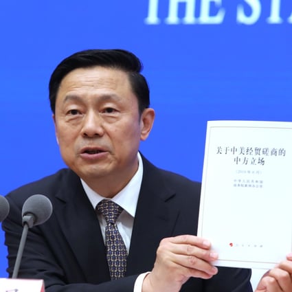 Guo Weimin, vice director of the Information Office of the State Council, announces the council’s paper on the trade war talks with the US on Sunday. Photo: Simon Song