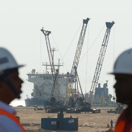 Pumps dredge sand near to Colombo’s main seaport. China, India and Japan are all helping Sri Lanka to develop the port. Photo: AFP