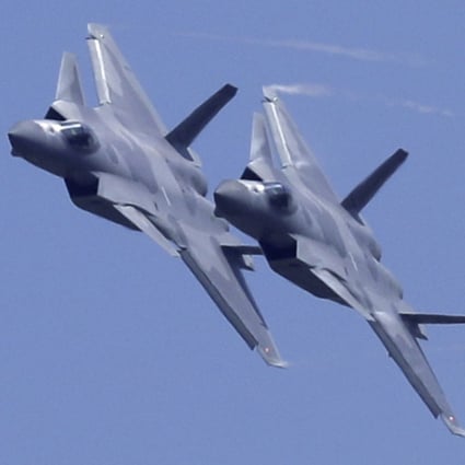 Two Chinese J-20 stealth fighter jets perform at an air show in Guangdong province last year. Photo: AP
