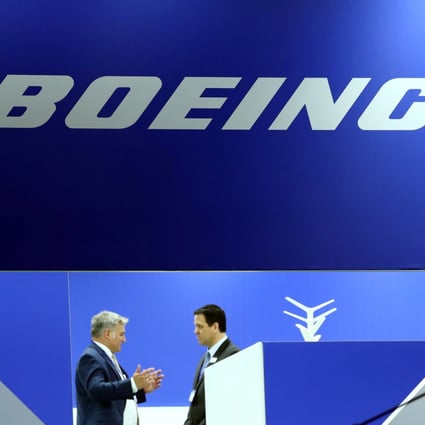 Visitors talk at the Boeing stand during the European Business Aviation Convention and Exhibition (EBACE) at Cointrin Airport in Geneva in May. Photo: Reuters