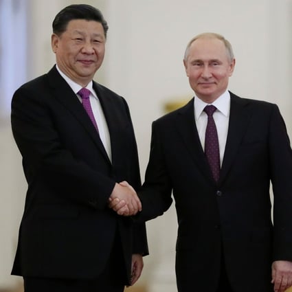 Russian President Vladimir Putin greets Chinese President Xi Jinping at the Kremlin in Moscow on Wednesday. Photo: AFP