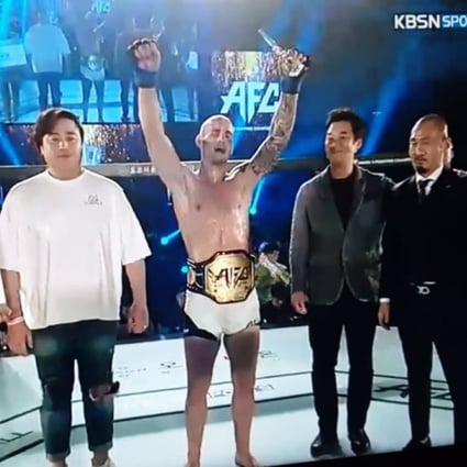Sasha Palatnikov raises his arms in victory. Photo: Twitter