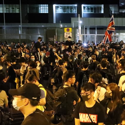 Hundreds gather outside the Legco building in Tamar after it issued an amber security alert. Photo: Dickson Lee